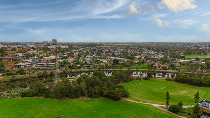 Panoramic Aerial Drone view of Inner Suburbs of Melbourne housing, roof tops, the streets and the parks, the roads and trees of Ascot Vale Moonee Ponds Brunswick Essendon and Maribyrnong in VIC Victor
