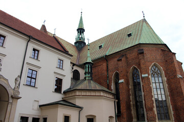 Obraz premium Saint Francis Assisi Basilica August 2024 Gothic brick church beside monument of Jozef Dietl