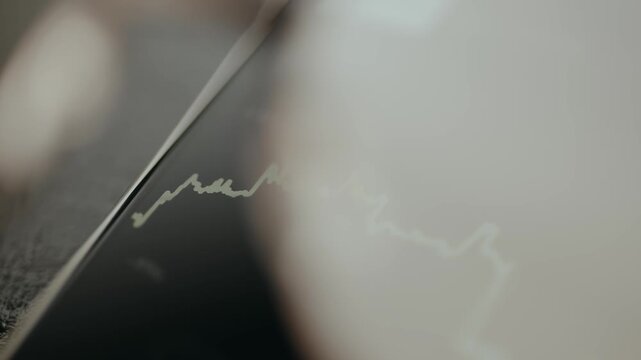 Linear graph with a highlighted point, view through eyeglasses