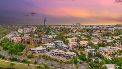 Obraz premium Panoramic Aerial Drone view of Inner Suburbs of Melbourne housing, roof tops, the streets and the parks, the roads and trees of Ascot Vale Moonee Ponds Brunswick Essendon and Maribyrnong in VIC Victor