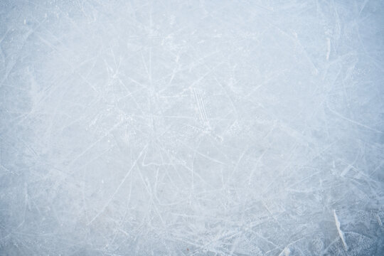 Natural scratched ice at the ice rink as texture or background for winter composition