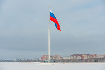 The Russian flag on a high flagpole on the embankment. Saint Petersburg, Russia - 28 Jan 2026