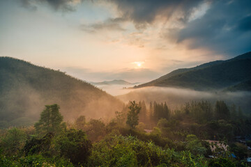Sunrise over Khao Krajom mountain with foggy in tropical rainforest at Suan Phueng, Ratchaburi © Mumemories