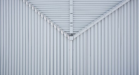 Obraz premium Birds eye composition of building roof with contemporary ribbed galvanized steel panels and fasteners