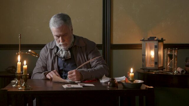 18th century man signing a document and putting a wax stamp