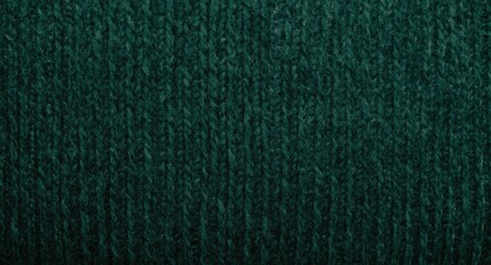 Fototapeta premium Detailed texture background of thick knitwear fabric with visible loden color and soft lighting