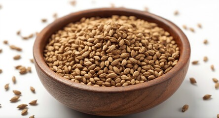 Close up of ajwain carom seeds in rustic wooden bowl on white backdrop for spice and medicinal uses