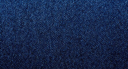 Close up view background of dark blue denim textile featuring detailed weaving and fabric texture
