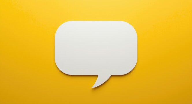 Elegant white speech bubble silhouette on a matte yellow backdrop with copy space