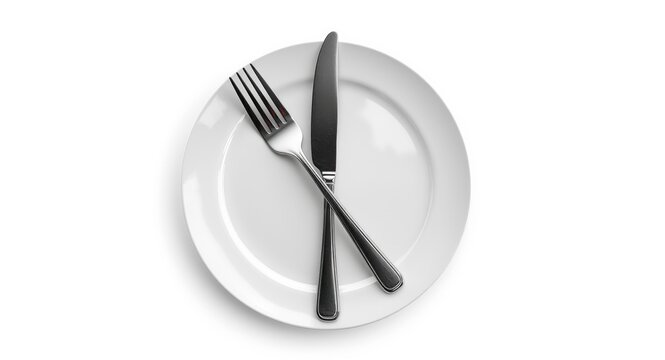 Crossed cutlery fork and knife on a white plate isolated with empty background