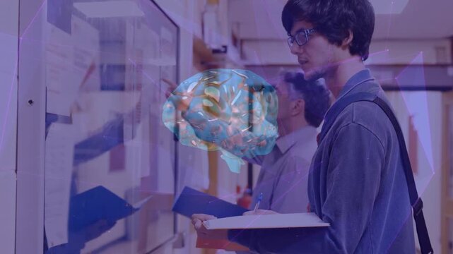 Animation of brain rotating over caucasian male student writing in school