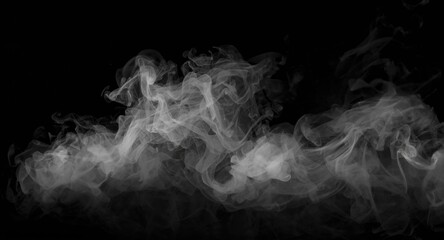 Delicate fog and steam creating a white mist effect on black surface