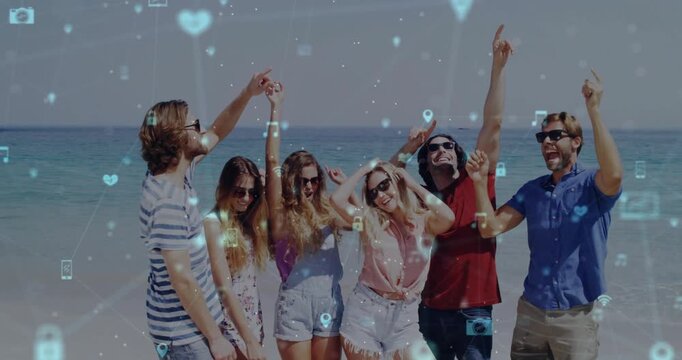 Friends dancing on sunny beach with floating social media icons appearing and boosting marketing
