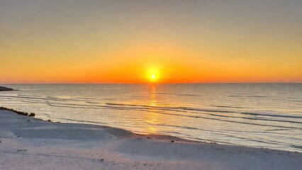 Fototapeta premium Sun rising over rippled sea and sandy coastal foreground.