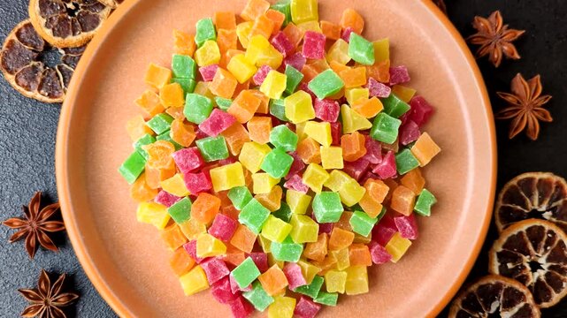 Candied fruit in colorful cubes as an ingredient for baked goods and sweets. Candied fruit as a food background for your design