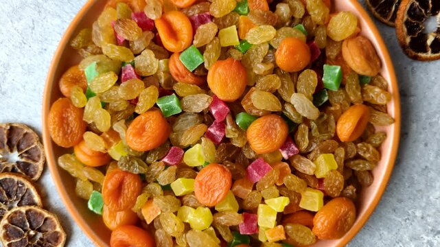 Dried apricots, raisins, and candied fruits as ingredients for baked goods and sweets. Dried fruits as a food background for your design