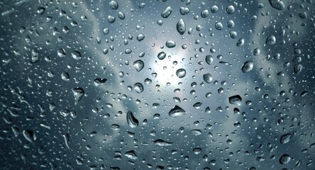 Detailed image of raindrops reflecting sunny sky