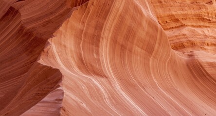 Obraz premium Unique desert rock structure with fine bedrock layers in brown and peach tones closeup