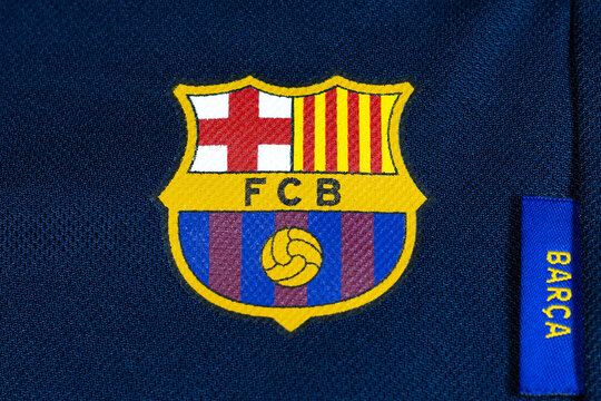 KYIV, UKRAINE - March 05, 2026 :  FC Barcelona crest on dark blue sports fabric. Close up, famous spain football club logo.