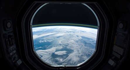 Fototapeta premium Earth's horizon viewed through a window on the space station