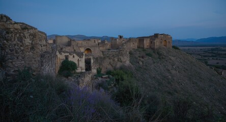 Fototapeta premium Medieval ruined cities along historic Silk Road trade path at dusk