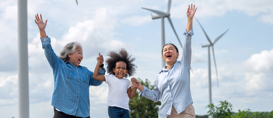 Woman and two children are jumping in the air