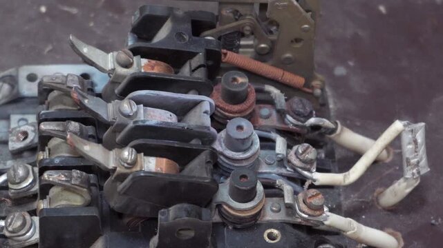 Contact Group of a Three-Pole Circuit Breaker, Inside of an Old Electrical Circuit Breaker