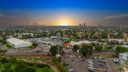 Obraz premium Panoramic Aerial Drone view of Inner Suburbs of Melbourne housing, roof tops, the streets and the parks, the roads and trees of Ascot Vale Moonee Ponds Brunswick Essendon and Maribyrnong in VIC Victor