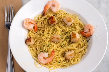 angel hair pasta  top with scallops and shrimp
