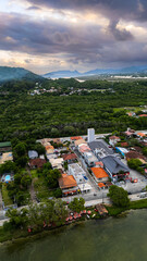 Fototapeta premium Aerial Waterfront Village Boats Restaurants Atlantic Forest Hills Lagoa Da Conceicao Florianopolis Brazil Island Coastal Scenery Santa Catarina South America Travel Destination