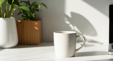 A white mug on a windowsill with plants