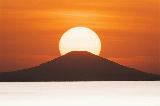 Sunset over mountain silhouette
