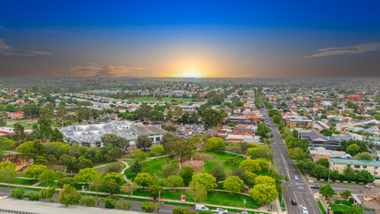 Obraz premium Panoramic Aerial Drone view of Inner Suburbs of Melbourne housing, roof tops, the streets and the parks, the roads and trees of Ascot Vale Moonee Ponds Brunswick Essendon and Maribyrnong in VIC Victor