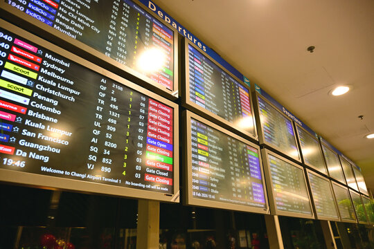 Electronic flight information display board showing departures at Singapore Changi Airport terminal 3. Major international aviation hub and global travel gateway in Asia