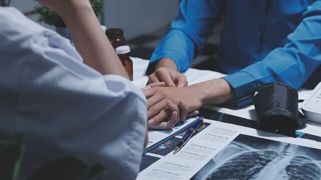 Physiotherapist holds elderly patient&rsquo;s hands, offering emotional support and encouragement, creating a trusting relationship that fosters confidence in recovery.