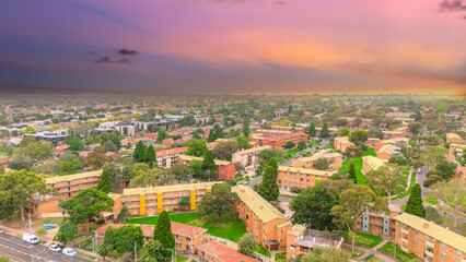Fototapeta premium Panoramic Aerial Drone view of Inner Suburbs of Melbourne housing, roof tops, the streets and the parks, the roads and trees of Ascot Vale Moonee Ponds Brunswick Essendon and Maribyrnong in VIC Victor