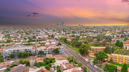 Fototapeta premium Panoramic Aerial Drone view of Inner Suburbs of Melbourne housing, roof tops, the streets and the parks, the roads and trees of Ascot Vale Moonee Ponds Brunswick Essendon and Maribyrnong in VIC Victor