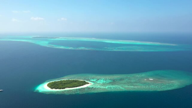 Drone Footage of Maldives Atoll with Lagoon and Tropical Vegetation