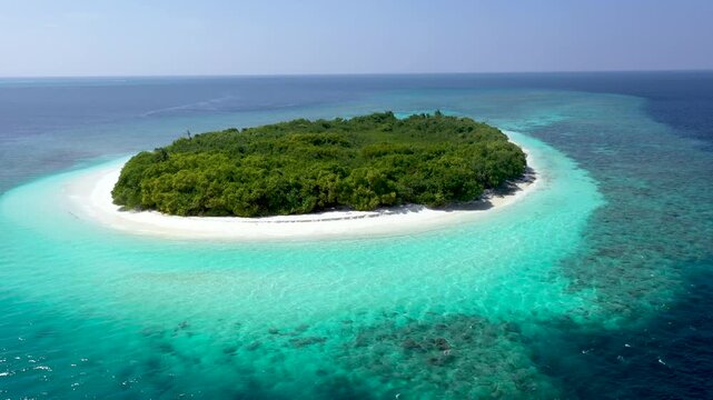 Aerial view of Maldives tropical island and coral reef