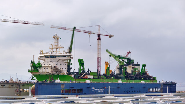 Port Expansion And Maritime Infrastructure Dredging Vessel in dry dock At The New Port Of Algeciras In Campamento Andalucia Spain Reflecting Global Trade And Shipping