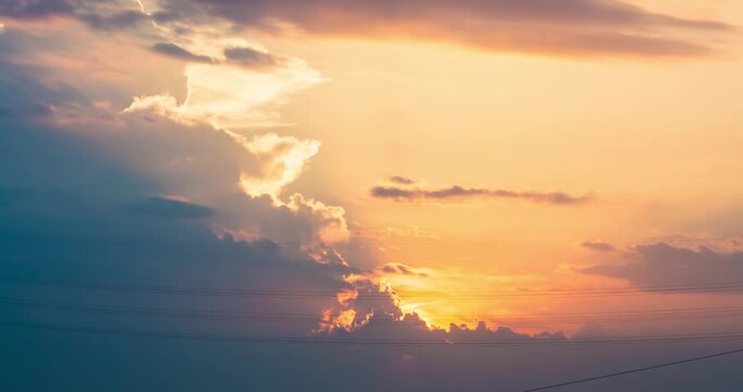 Dramatic Golden Hour Sky with Storm Clouds and Crepuscular Rays
