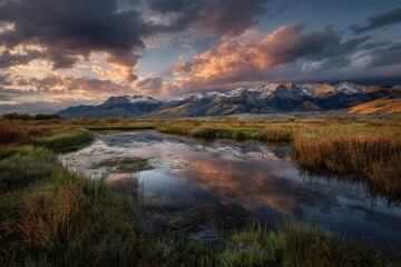 Obraz premium In an open water lake shows snow-capped mountains