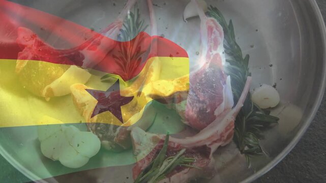 Steel pan holding lamb, garlic, rosemary, Ghana flag overlay entering left, tinting for branding