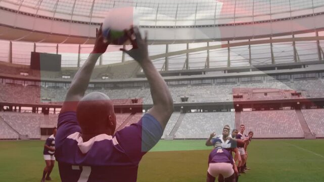 Player wearing number 2 preparing and throwing rugby ball, lifters raising jumper winning ball
