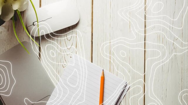 On second frame contour lines expanding and sweeping over notepad and pencil, highlighting desk