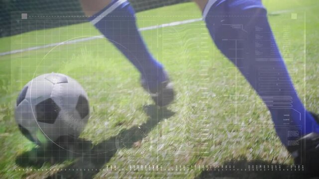Player in blue socks and black cleats touching football, aiming at goal line, overlays showing path