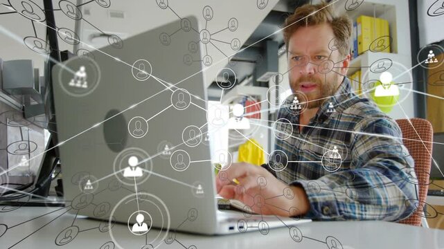 Vertical video: Man typing laptop, touching pad, tech nodes lighting and responding, analyzing data