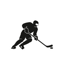 Fototapeta premium Silhouette of hockey player in action on ice rink.