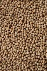 Fototapeta premium Raw uncooked chickpeas background top view.