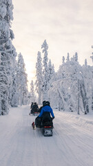 Snowmobile adventure through the winter wonderland of Akaslompolo, Lapland © Fokke Baarssen